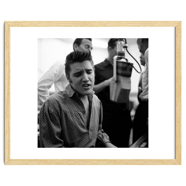 The American singer Elvis Presley during a recording session in 1956.