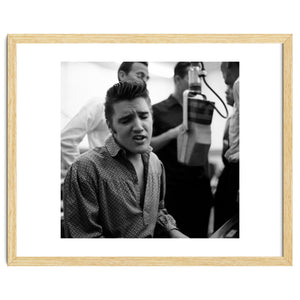 The American singer Elvis Presley during a recording session in 1956. by Album