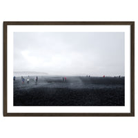 Tourists on the black sand beach - Iceland