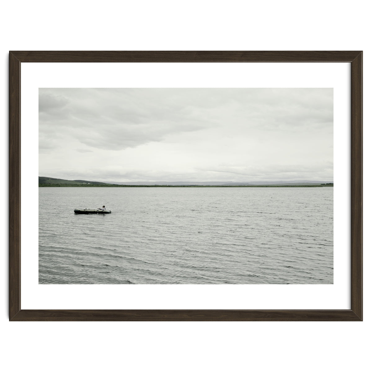 A boy pedaling the Board on the Lake - Iceland