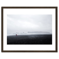 Family walking on the black sand beach - Iceland