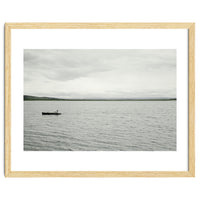 A boy pedaling the Board on the Lake - Iceland