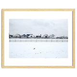 A seagull and snow covered houses thumbnail