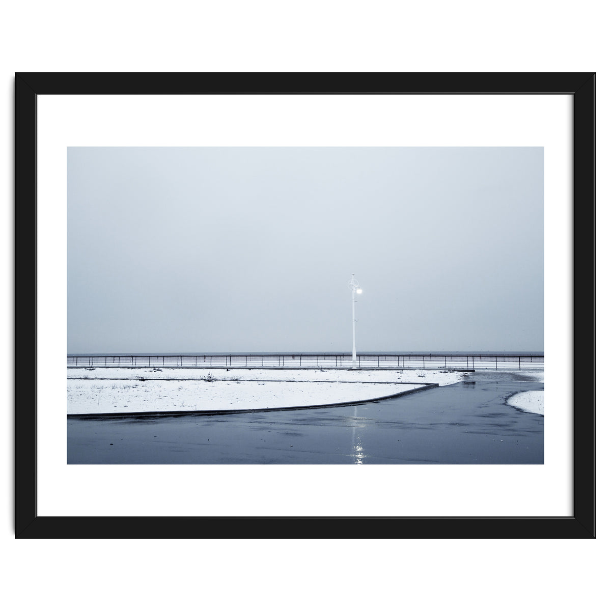 Street light turned on the winter snow street