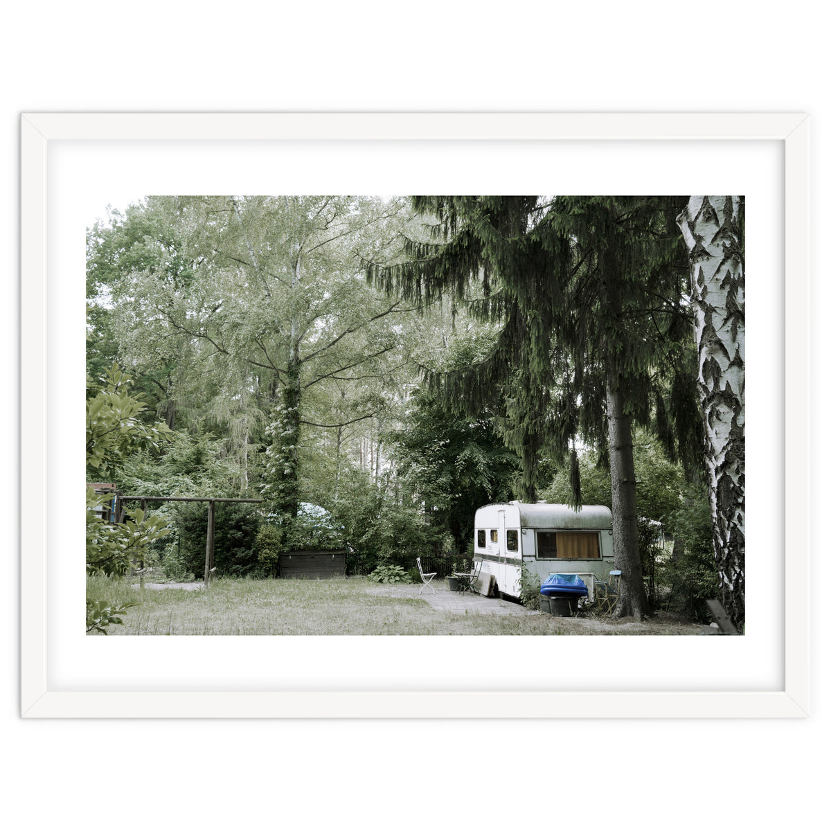 Travel trailer in the green garden