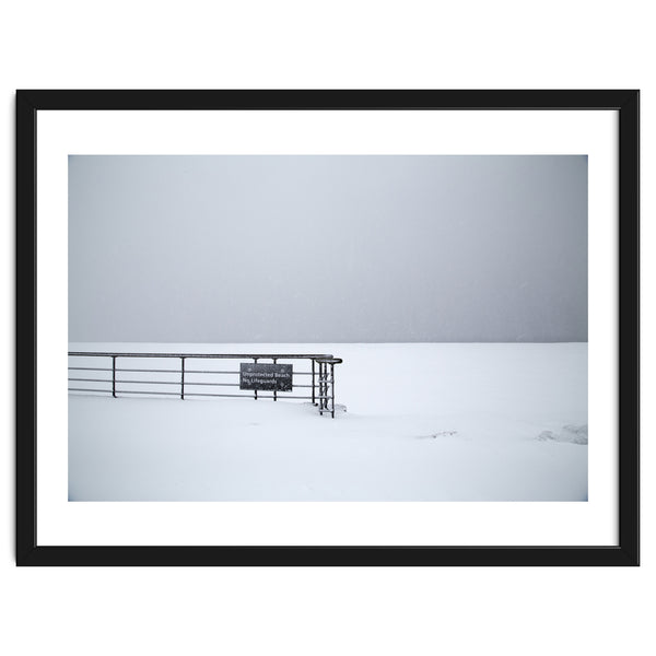 No lifeguards on the sign board in the winter snow beach