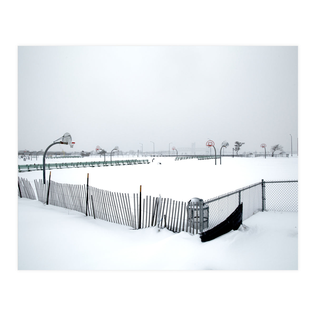 Snow-covered deserted basketball court in winter (Print Only)
