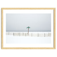 Fake palm tree in the winter snow beach