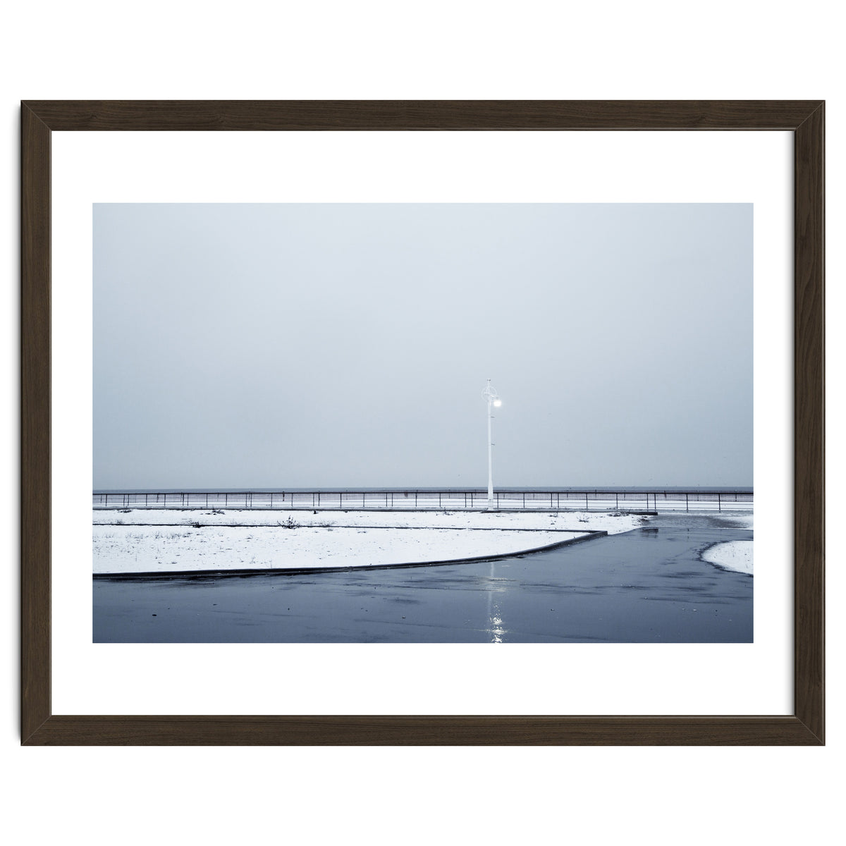 Street light turned on the winter snow street