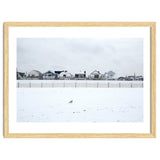 A seagull and snow covered houses thumbnail