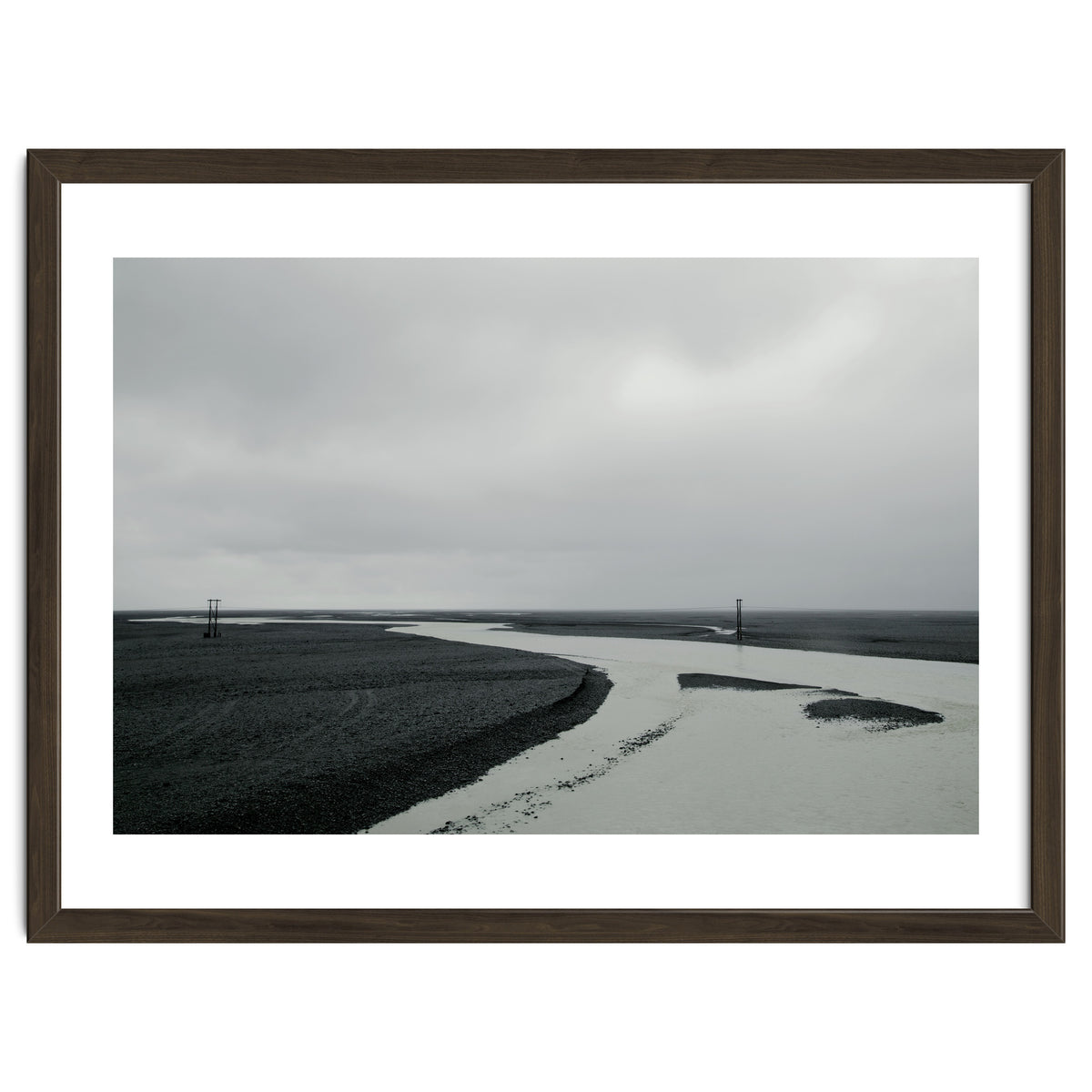 River passing through a black volcanic road - Iceland