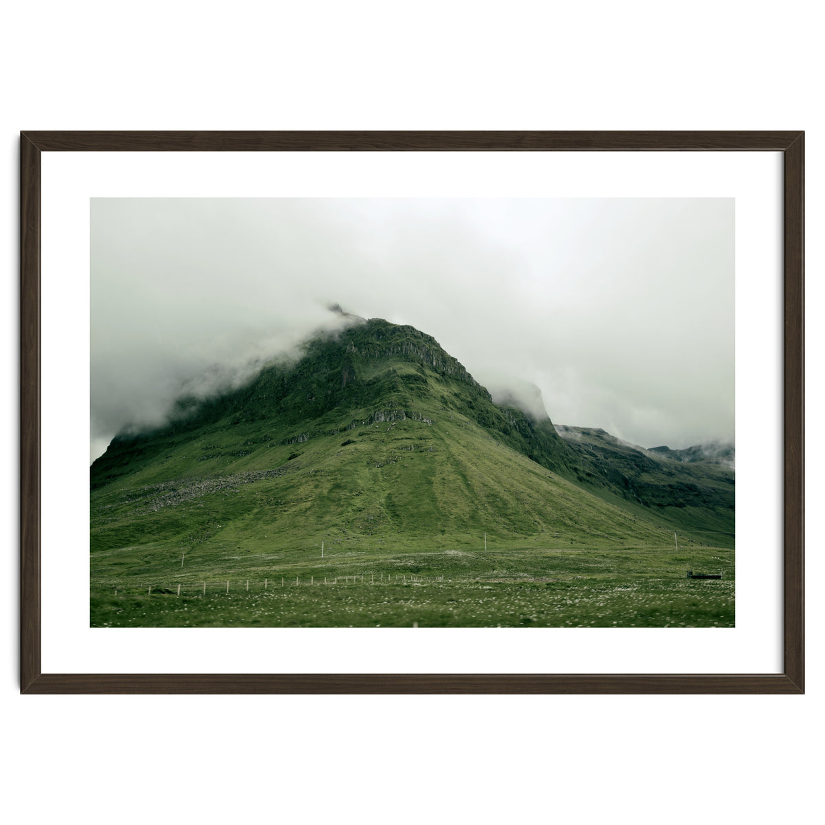 Green mountain covered in clouds - Iceland