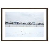 A seagull and snow covered houses thumbnail