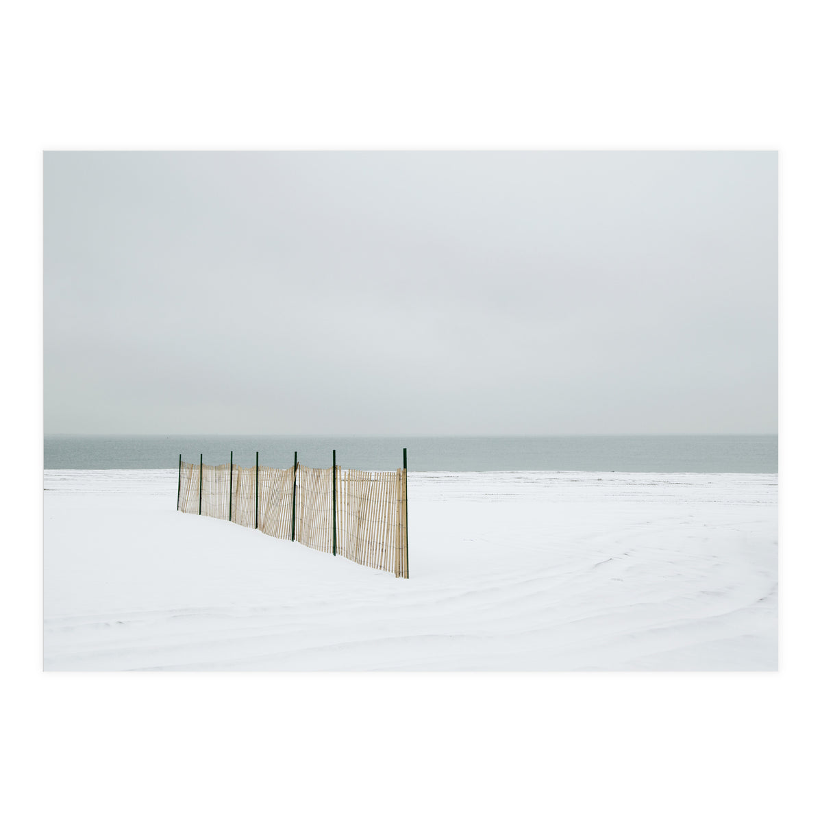 Wood fence in the winter snow beach (Print Only)