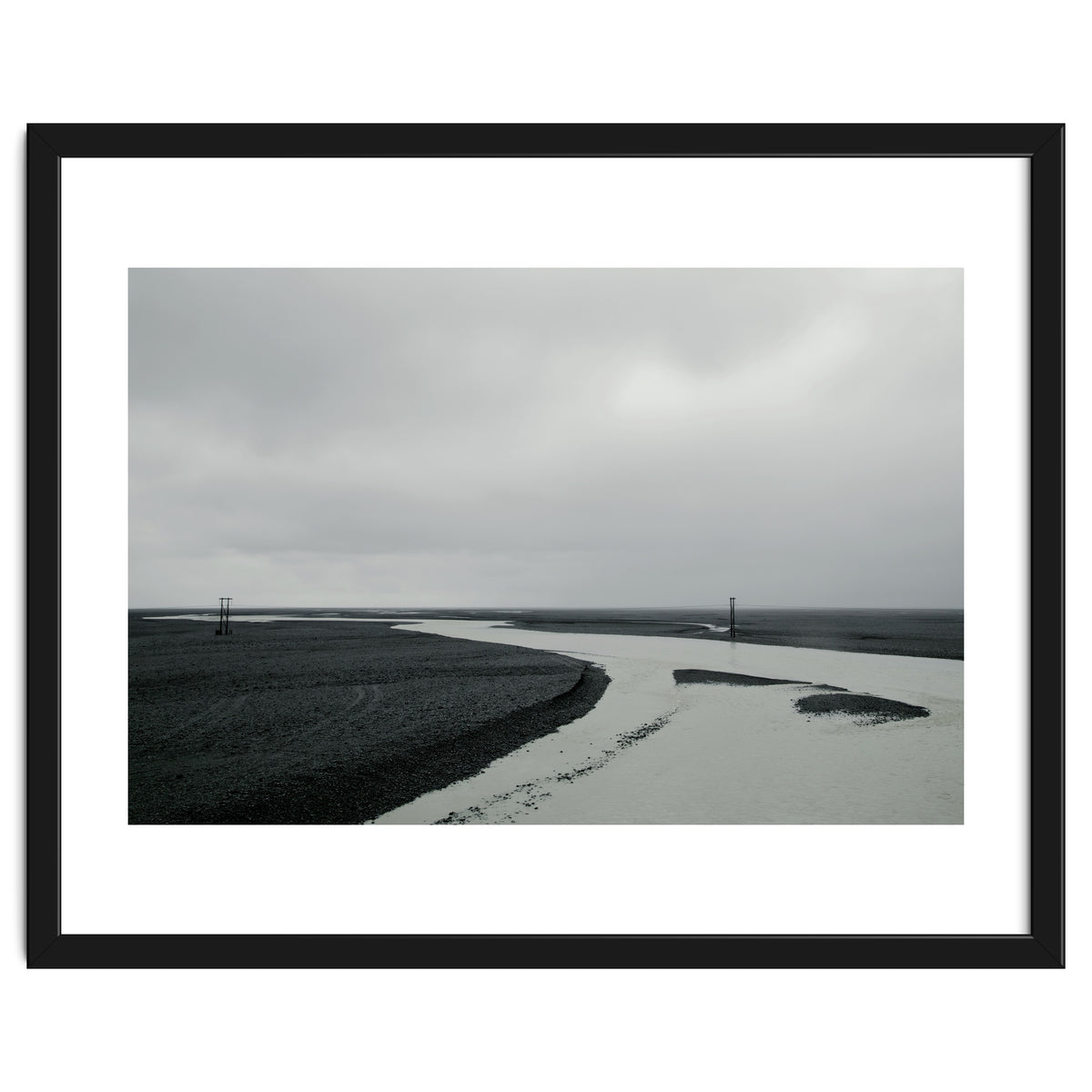 River passing through a black volcanic road - Iceland