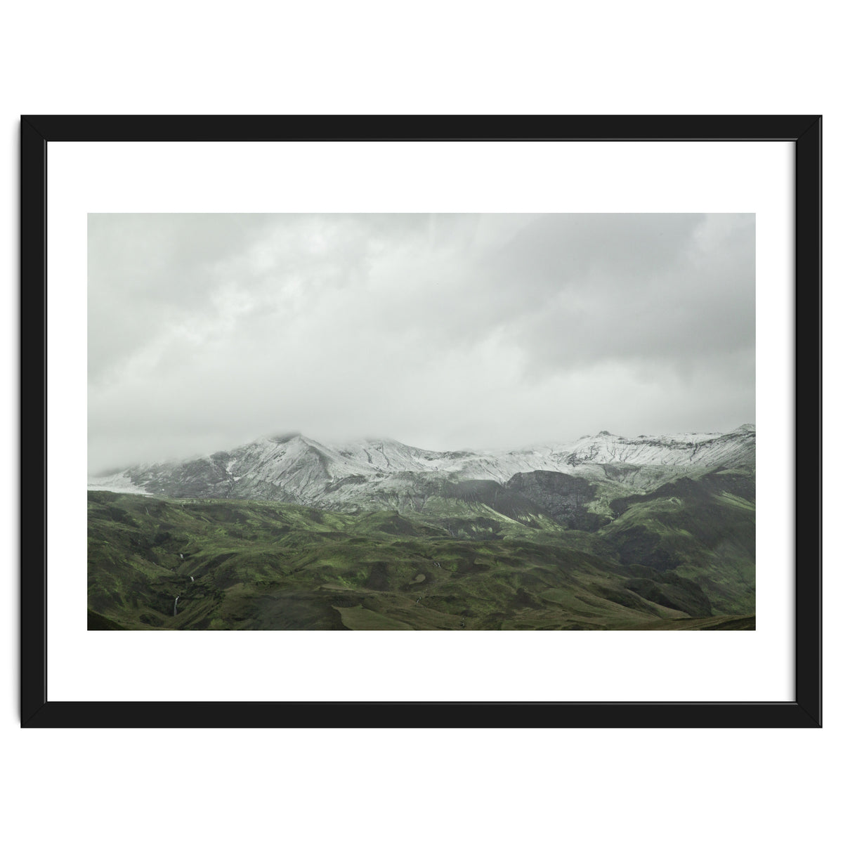 Snow-covered green mountains - Iceland