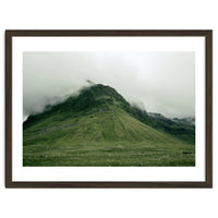 Green mountain covered in clouds - Iceland