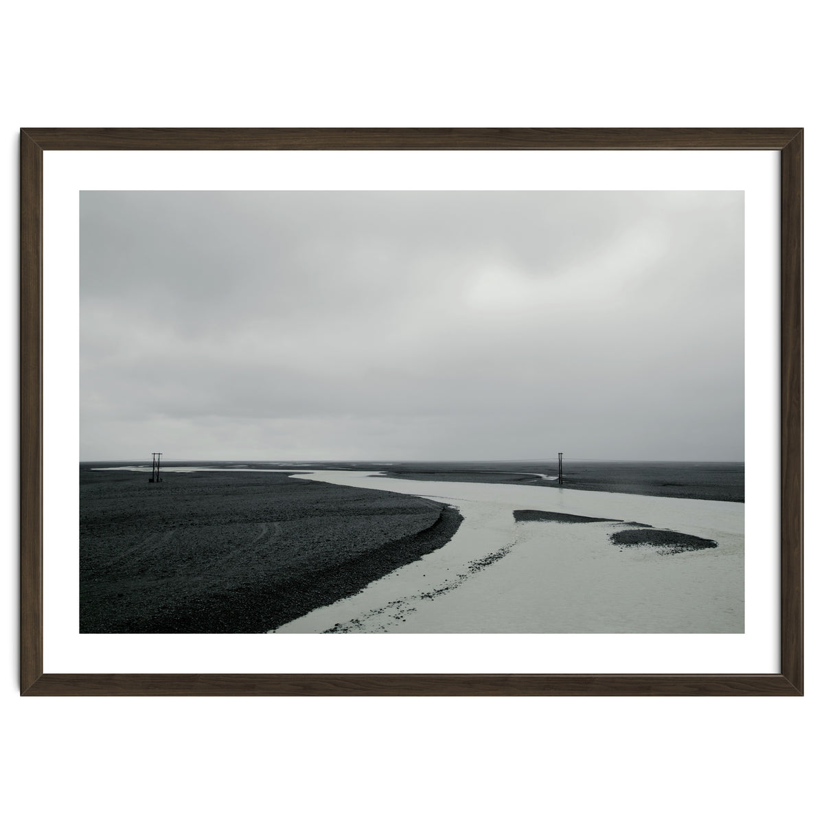 River passing through a black volcanic road - Iceland
