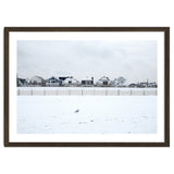 A seagull and snow covered houses thumbnail