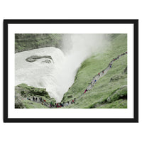 Tourists walking around the waterfall - Iceland