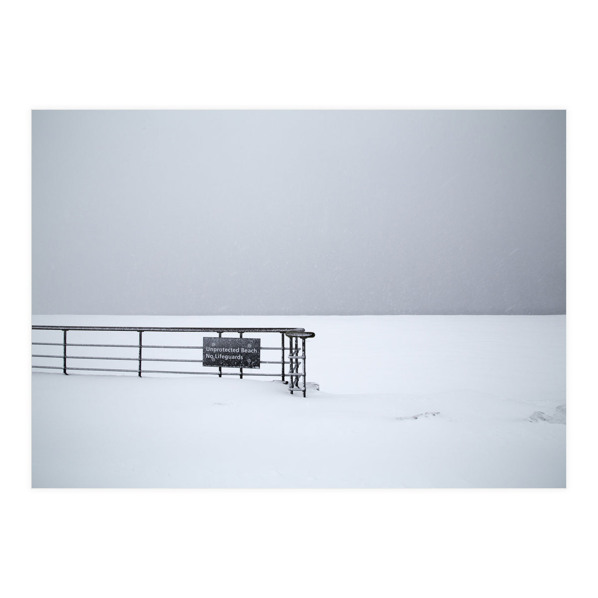 No lifeguards on the sign board in the winter snow beach (Print Only)