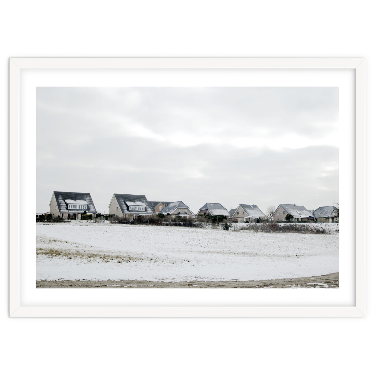 Snow covered houses on the hill
