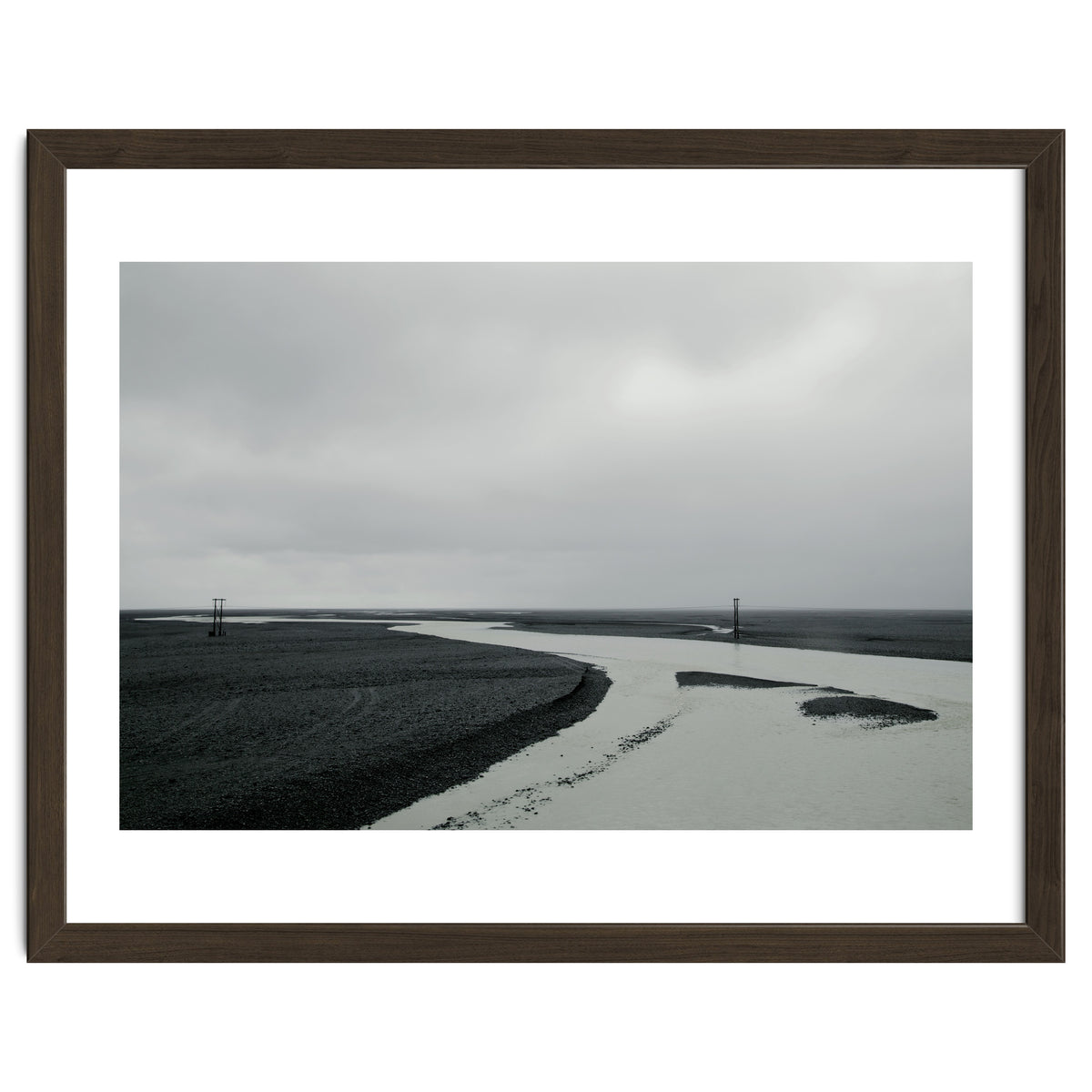 River passing through a black volcanic road - Iceland