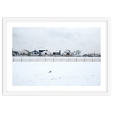 A seagull and snow covered houses thumbnail