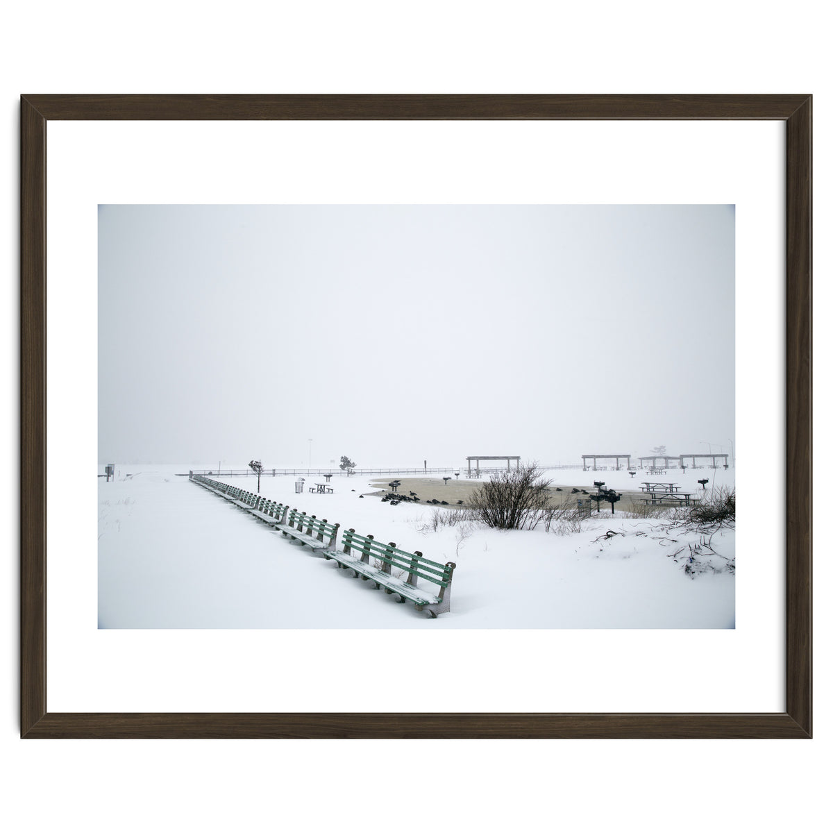 No people on a bench in the snowy winter