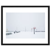 Snow-covered Basketball court and side bench