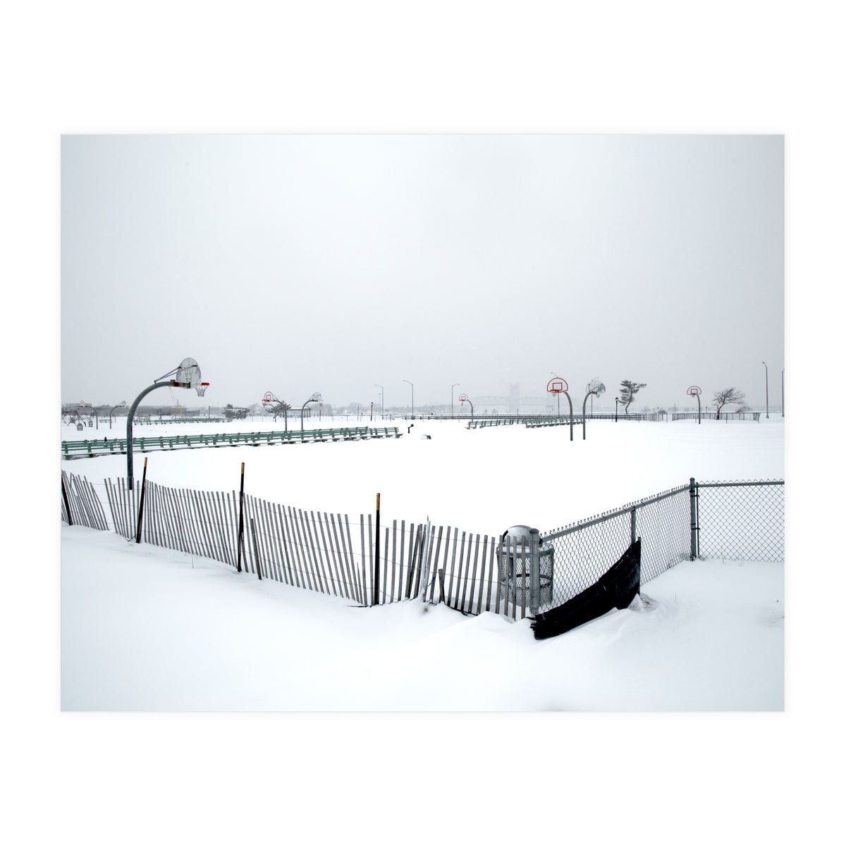 Snow-covered deserted basketball court in winter (Print Only)
