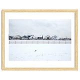 A seagull and snow covered houses thumbnail