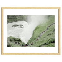 Tourists walking around the waterfall - Iceland