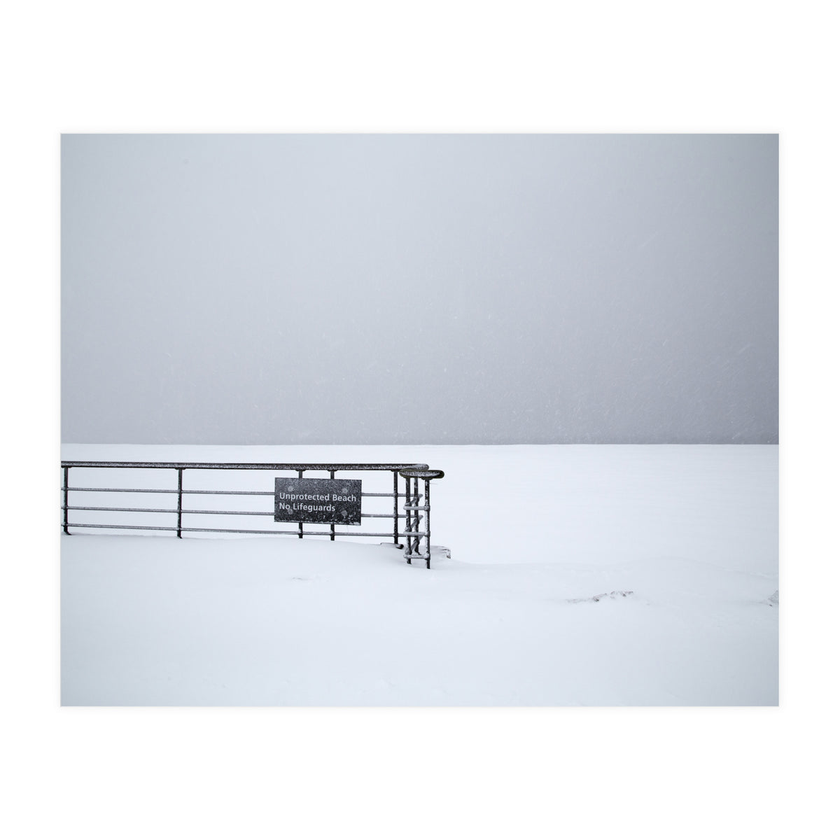 No lifeguards on the sign board in the winter snow beach (Print Only)