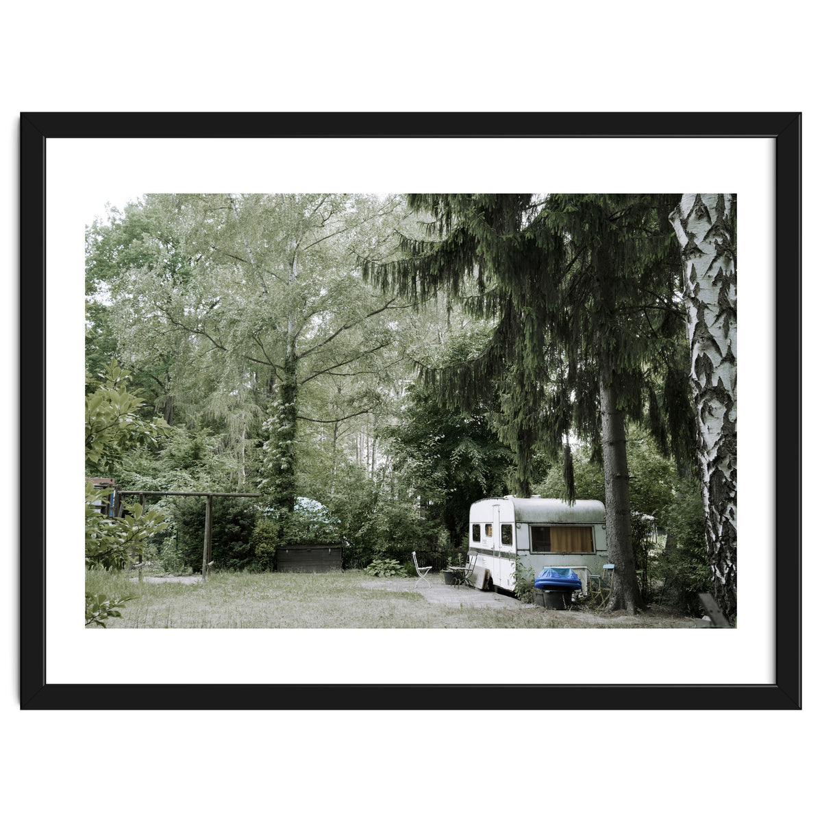 Travel trailer in the green garden