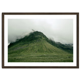 Green mountain covered in clouds - Iceland thumbnail
