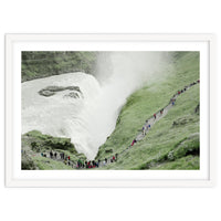 Tourists walking around the waterfall - Iceland