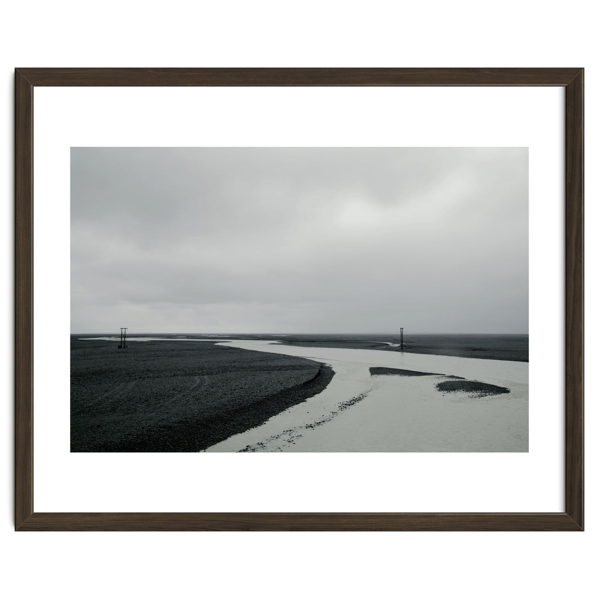 River passing through a black volcanic road - Iceland