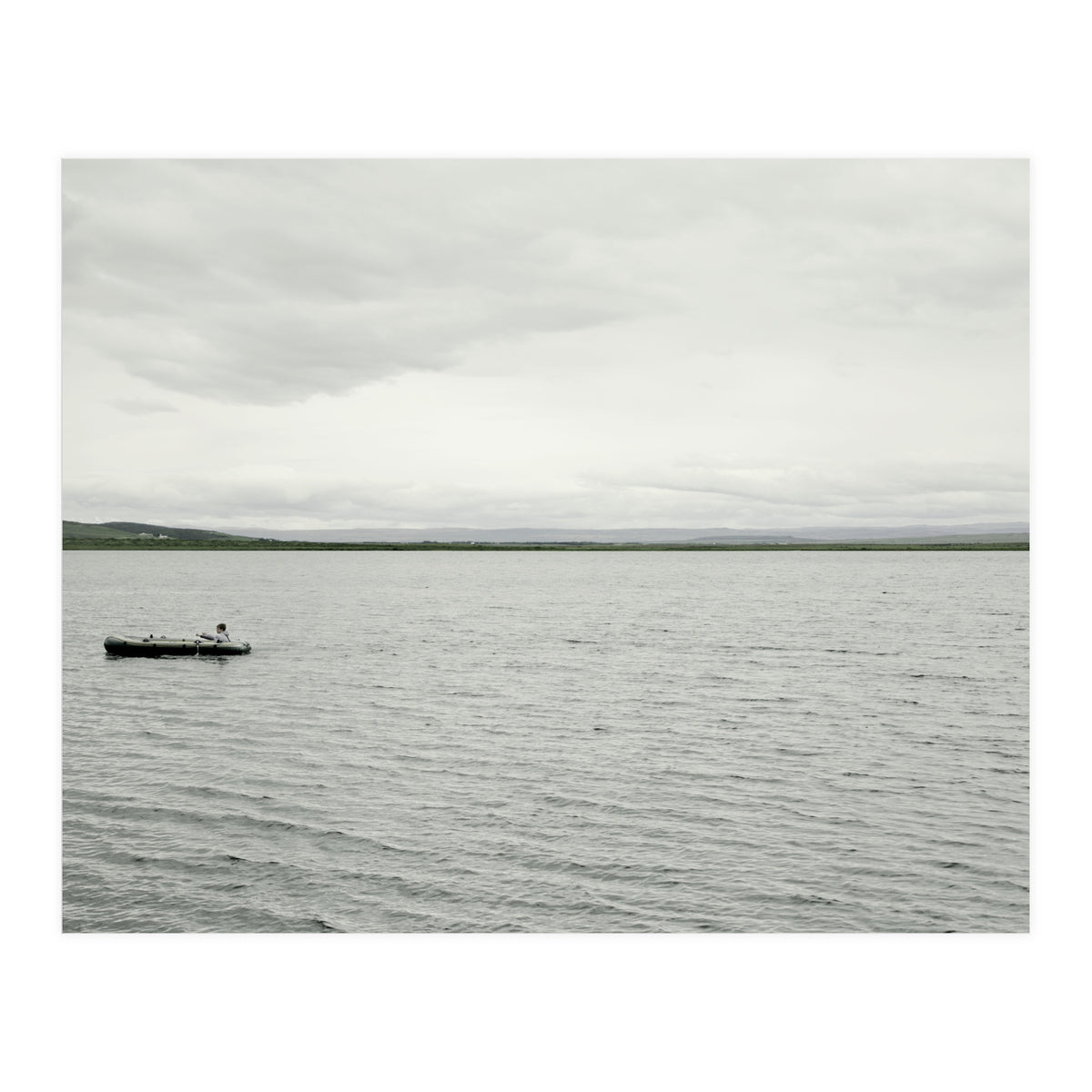A boy pedaling the Board on the Lake - Iceland (Print Only)