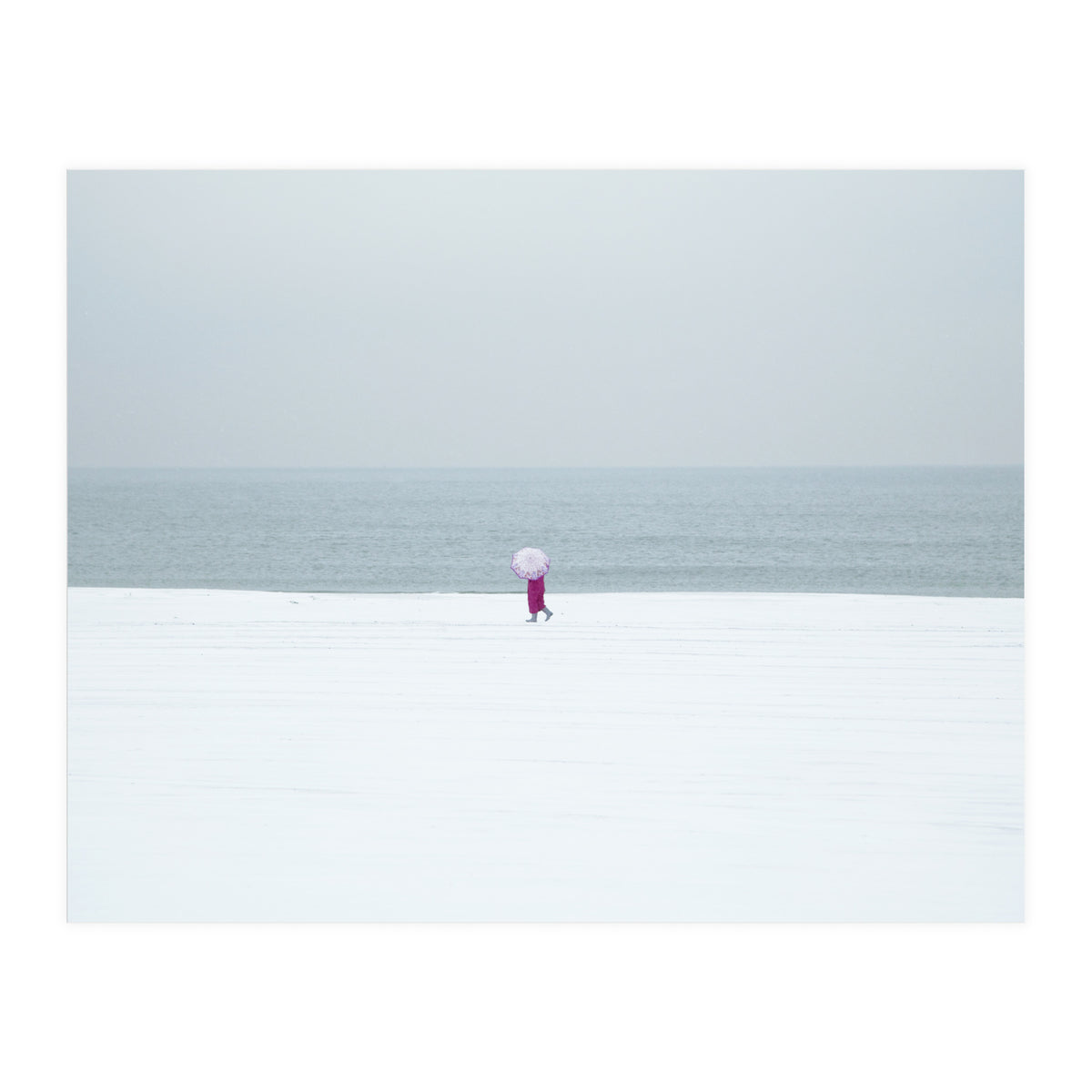 A walking woman in the winter snow beach (Print Only)