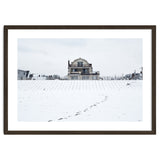 Footprints and house in winter snowscape thumbnail