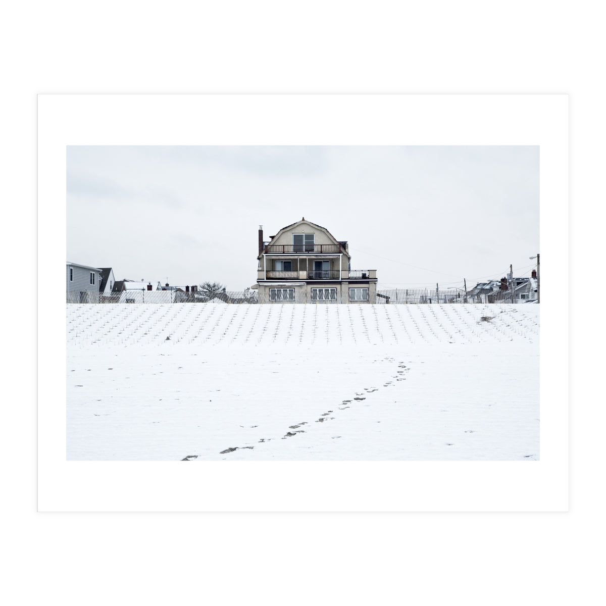 Footprints and house in winter snowscape (Print Only)