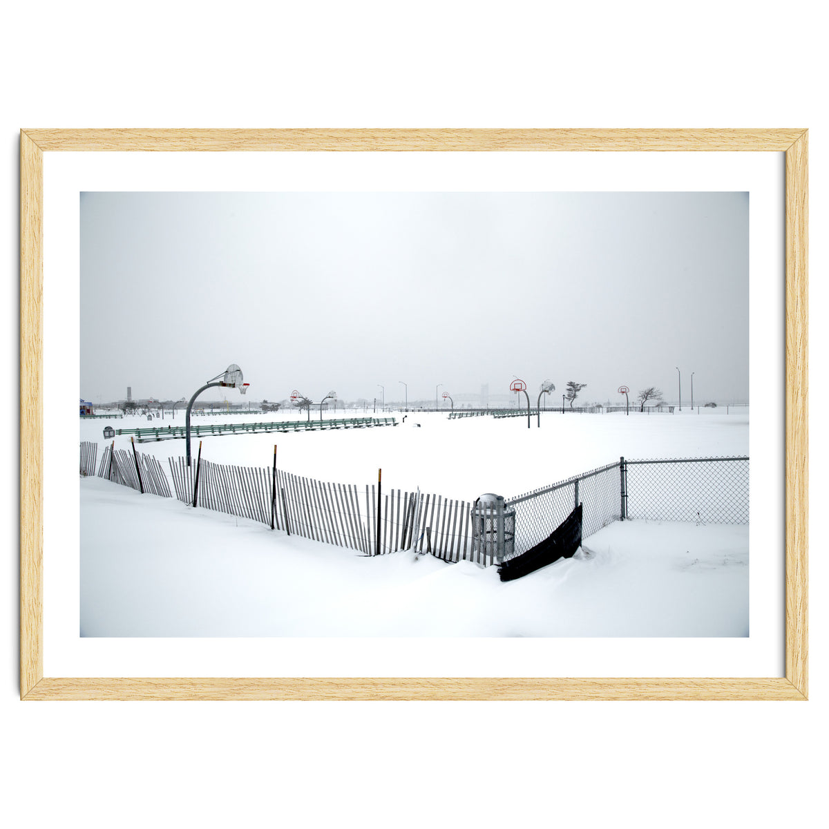 Snow-covered deserted basketball court in winter