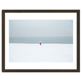 A walking woman in the winter snow beach thumbnail