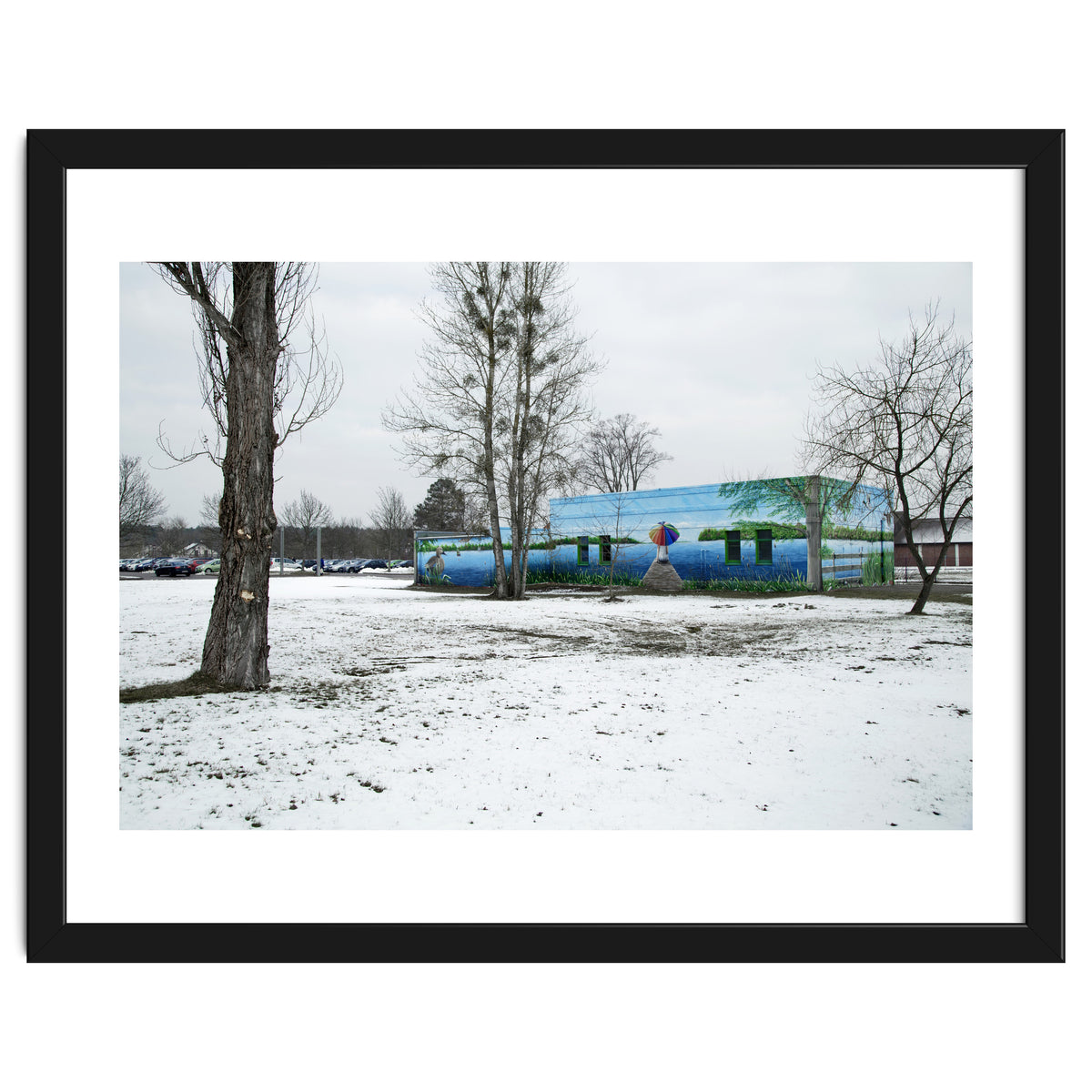 Colorful barn in the snowy ground landscape