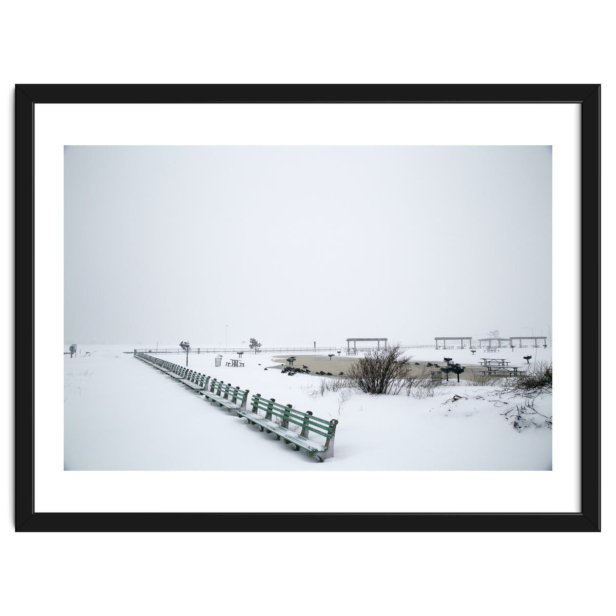 No people on a bench in the snowy winter