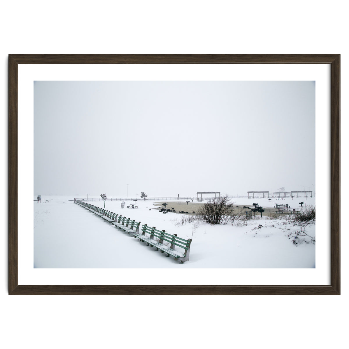 No people on a bench in the snowy winter