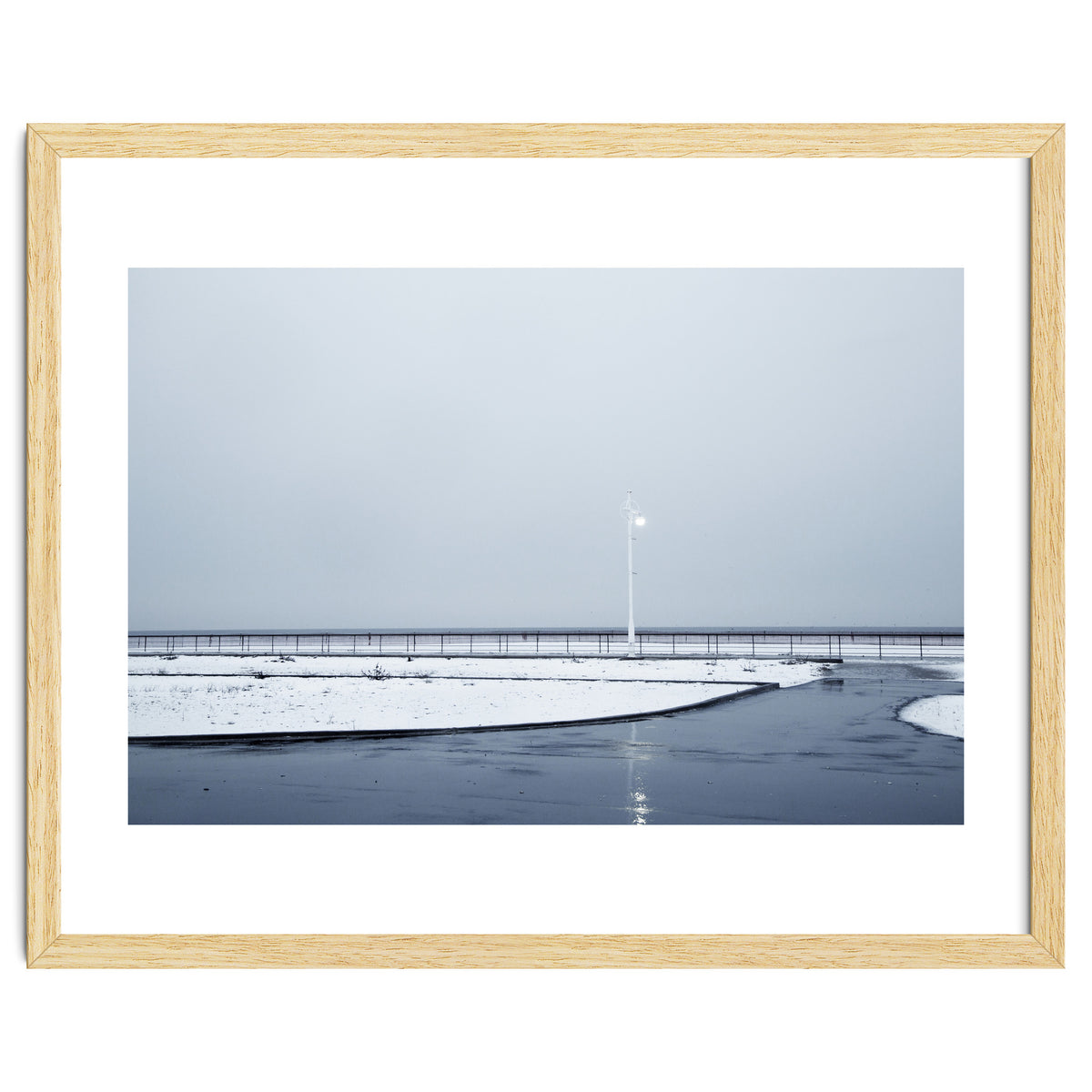 Street light turned on the winter snow street