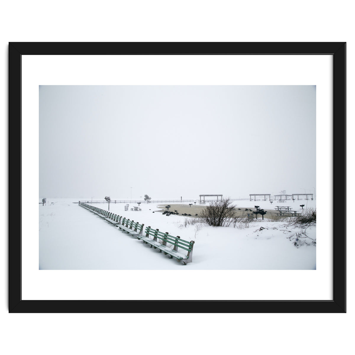 No people on a bench in the snowy winter