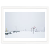 Snow-covered Basketball court and side bench